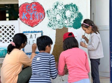 Students painting a mural