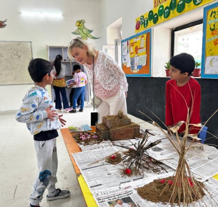 A teacher working with students on a project